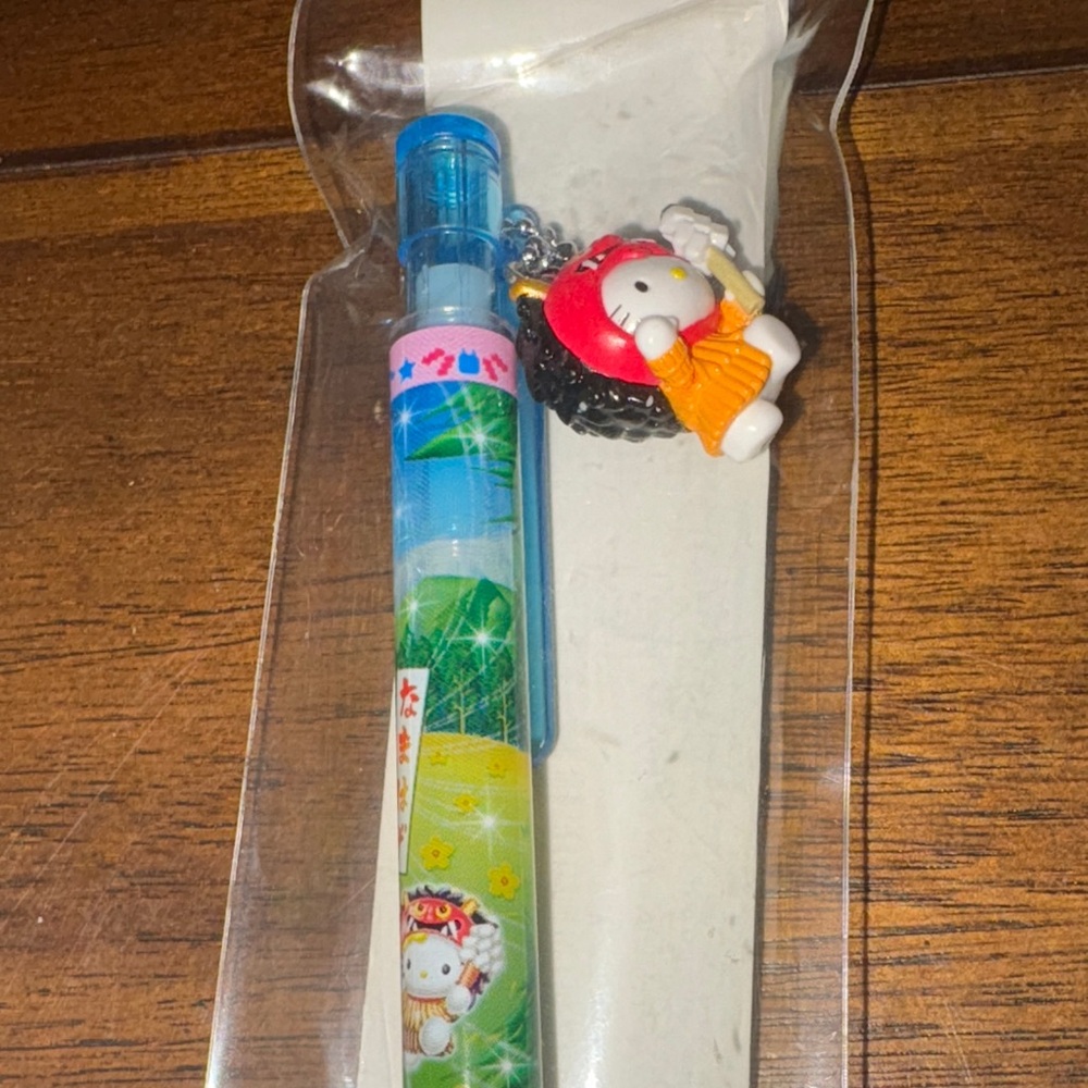 Sanrio Blue and Yellow Kids Pen with hello Kitty Charm
